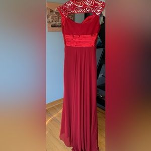 Beautiful red gown. Never worn. Great for prom, homecoming or formal events.